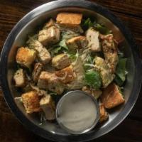Half Chicken Caesar Salad · Romaine, Shredded Parmesan, Jalapeño Cornbread Croutons, Caesar Dressing