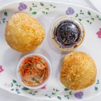 Sticky Rice Balls · Marinated pan chicken wrapped with sticky rice (deep fried), served with kimchi and house sp...