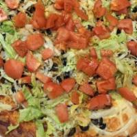 Taco Pizza · Lettuce, tomato and garlic spread with sour cream and salsa on the side.
