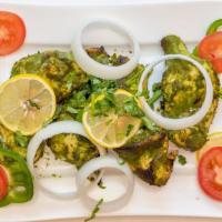 Hariyali Tikka Tandoori · Tender boneless pieces of chicken breast marinated in fresh cilantro, and baby spinach, barb...