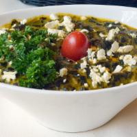 Saag Paneer · Fresh homemade cheese cubes cooked in spinach mildly flavored with fresh herbs and spices.