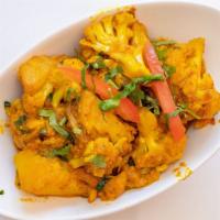Aloo Gobi · Fresh cauliflower and potatoes cooked with tomatoes, spices and fresh herbs.
