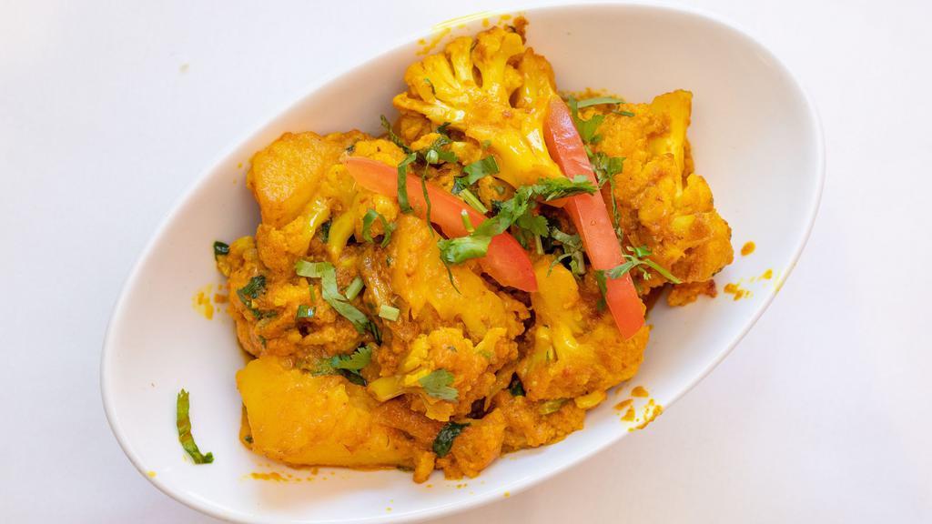 Aloo Gobi · Fresh cauliflower and potatoes cooked with tomatoes, spices and fresh herbs.