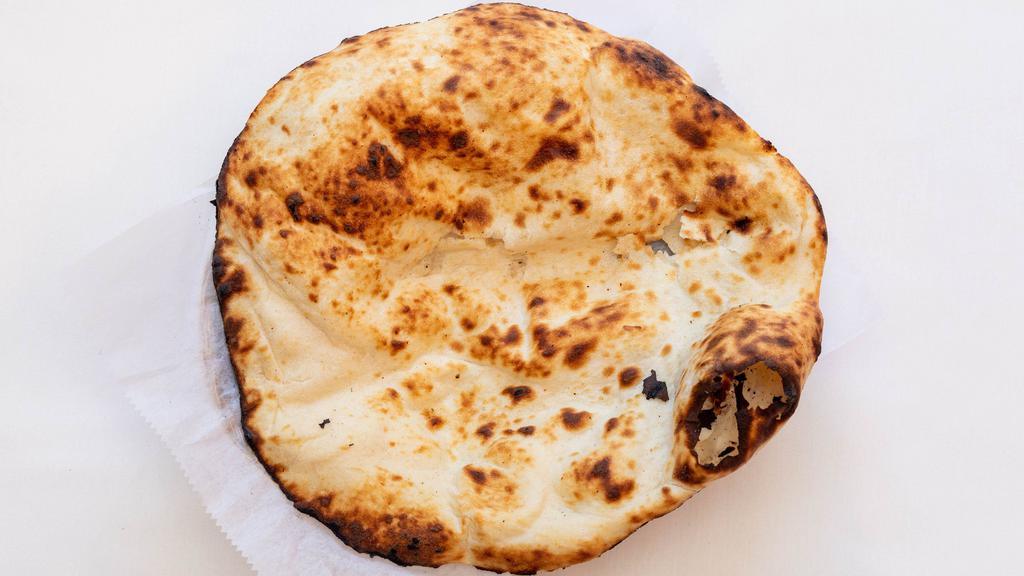 Naan · Leavened white flour bread baked in our clay oven.