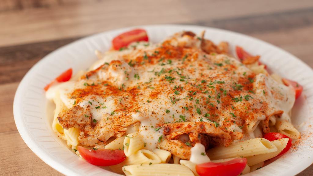 Cajun Chicken Alfredo · Perfectly cooked Fettuccine pasta with chicken smothered with a cajun flavored Alfredo Sauce, garnished with tomatoes.