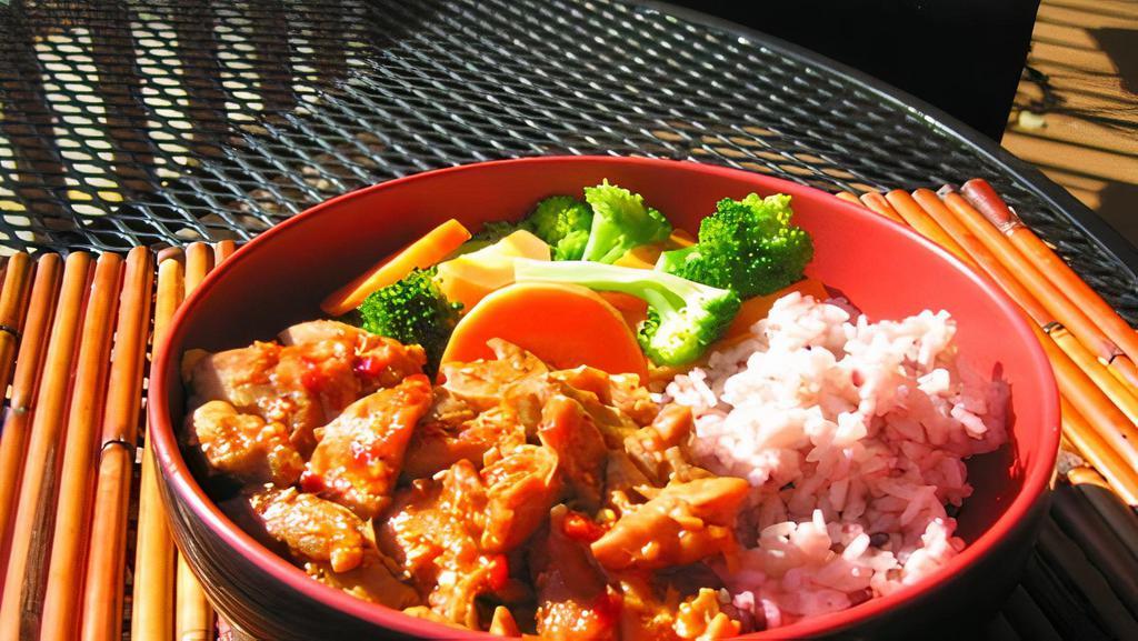 Spicy Chicken · Picked for you. Bite sized cuts of tender chicken in a delicious spicy marinade served with rice and steamed broccoli and carrots.