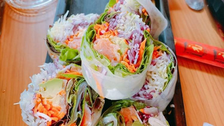 Smoked Salmon Roll · Smoked salmon, avocado, organic baby greens, green cabbage, carrot, and red cabbage in a tapoica wrap. Served with wasabi and soy sauce or hot red pepper sauce.