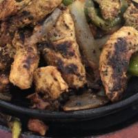 Fajitas Vegetarianas · Mixed seasonal vegetables marinated in a citrus blend and presented on a sizzling skillet. S...
