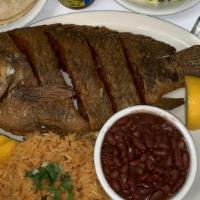 Pescado Frito / Fried Fish Platter · Whole fried red snapper fish. Served with rice, beans and salad.