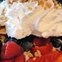 Sunshine · Crepe served with strawberry or vanilla yogurt, fresh berries topped with granola and served...