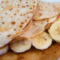 Graceland · Crepe with creamy peanut butter, bananas served with  honey on the side