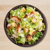 Exotica Chicken Caesar Salad · Chicken caesar salad served with lettuce, tomato, cheese, cucumbers, and turkey bacon