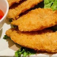 Coconut Prawns · Breaded coconut prawns deep fried and served with house sweet chili sauce. Tom chien dua.