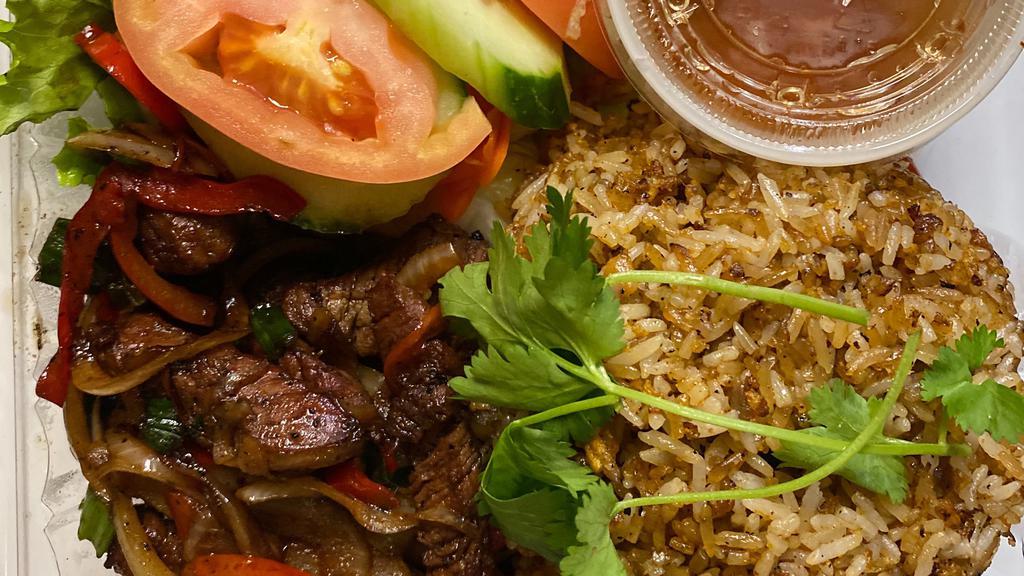 Shaking Beef Stir Fry · Wok-seared beef tenderloin cubes in our special soy pepper and wine sauce with onion, red bell
pepper served with Sriracha fried rice, pickled veggies and tomato slices.