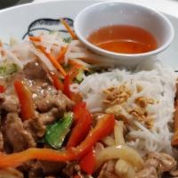 Bun Bo Xao Cha Gio - Sauteed Beef Bowl · Wok seared beef slices with bell peppers and onions served with vermicelli noodles and an eg...