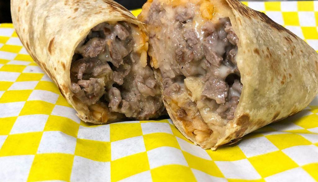 Burrito · Burrito filled with rice, beans, cheese, sour cream and your choice of meat.