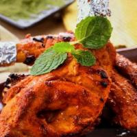 Tandoori Chicken (Half) · chicken marinade with yogurt, lime juice, garlic, ginger, garam masala, and turmeric  and co...