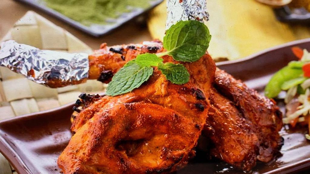 Tandoori Chicken (Half) · chicken marinade with yogurt, lime juice, garlic, ginger, garam masala, and turmeric  and cook in clay oven
4 pc