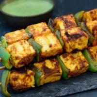 Paneer Tikka Kabab · Flavorful paneer , marinated in perfection and cooked to perfection in tandoor.
