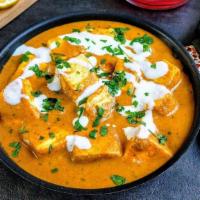 Paneer Butter Masala · Creamy curry made with onion, tomatoes, cashews, cream and butter with pieces of cottage che...