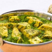 Hariyali Palak Paneer · Indian cottage cheese cooked with spinach and spices in this creamy and flavorful curry.