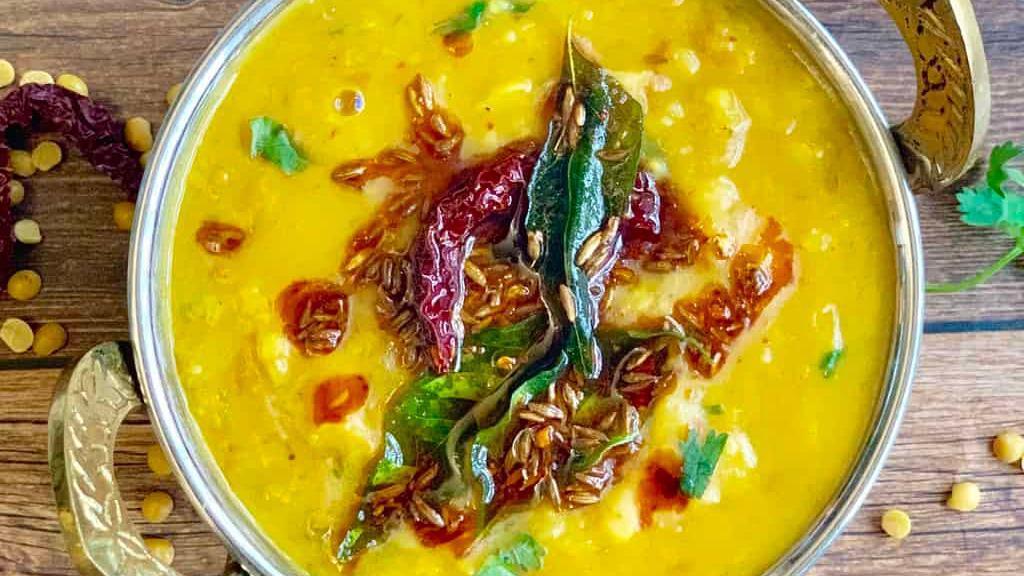 Daal Tadka · Yellow lentil soup tempered with cumin, mustard seeds, garlic, chilies, curry leaves in clarified butter.