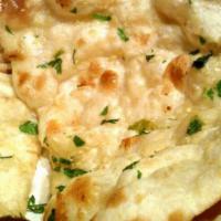 Butter Naan · Freshly baked flatbread with butter