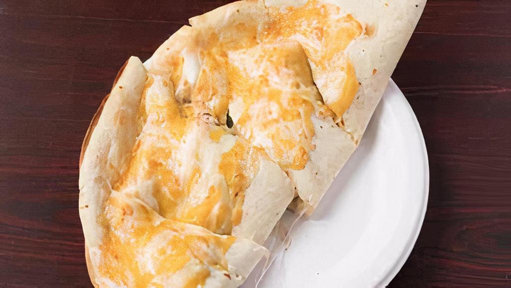 Chicken · Green pepper, onion, grilled chicken cooked with our secret sauce, provolone cheese, and cheddar cheese, served with salsa and sour cream.