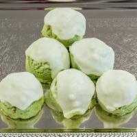 Pistachio Balls (Each) · A butter cookie with pistachio topped with vanilla icing.