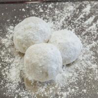 Snowballs (Each) · A butter cookie filled with pecans rolled in powdered sugar.