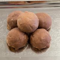 Chocolate Ball (Each) · Rich chocolate cookie filled with chocolate chips and topped with chocolate icing.