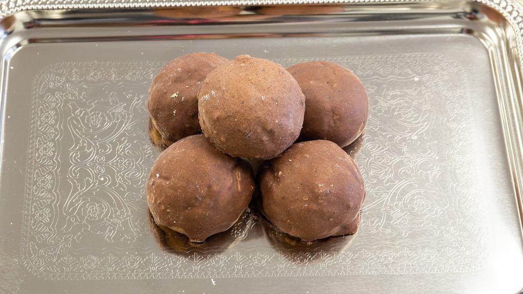 Chocolate Ball (Each) · Rich chocolate cookie filled with chocolate chips and topped with chocolate icing.