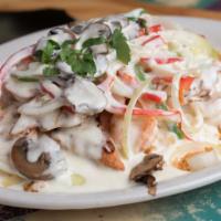 Berryhill Del Mar · Grilled fish and shrimp smothered with onions, poblano peppers and cilantro in a cream sauce...