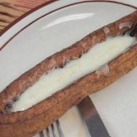 Roasted Sweet Plantain With Cheese · Platano maduro al horno con queso.