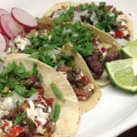 Tacos De Alambre · 4 Tacos. Served with beef meat, bacon, sausage, onion, red and green peppers with Oaxaca che...