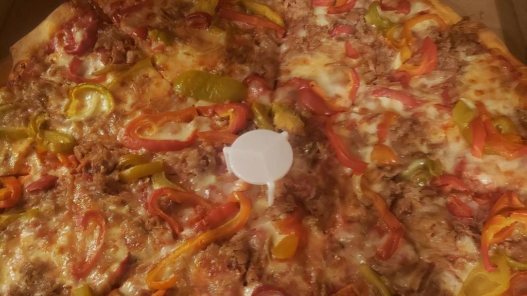 Tomato Pie Pizza · Plum tomatoes, parmesan cheese, fresh basil & olive oil. *no mozzarella cheese.