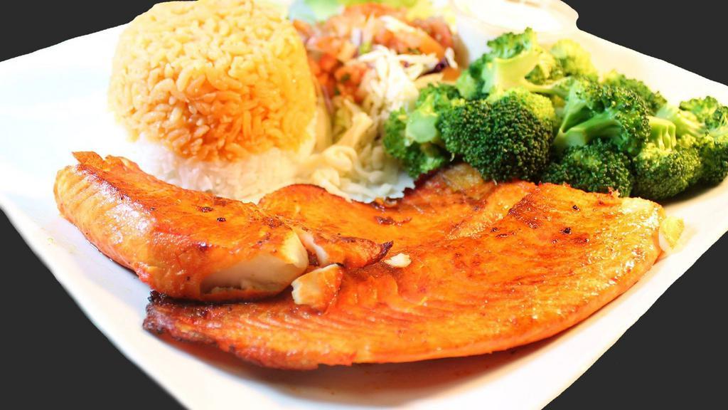 Salmon Cancun · Served with steamed vegetables and white rice.