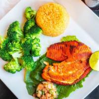 Fish Vallarta · Grilled white fish fillet served with broccoli, Spanish rice, white rice, and pico De gallo.