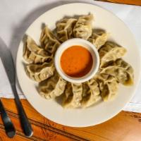 Momo · Steamed or fried Nepalese dumplings filled with ground chicken or vegetables. Served with to...