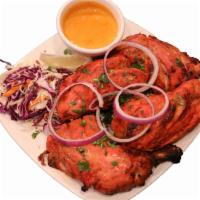 Chicken Tandoori · (King of kebabs) spring chicken marinated overnight with yogurt, ginger, garlic, and spices.