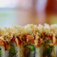 Yummy Yummy (Crunch) · Shrimp tempura, avocado, topped with spicy tuna, crunch flakes, eel sauce, spicy mayo