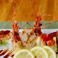 Nari Special · Shrimp tempura inside, one half with red snapper and tuna, the other half with  salmon, topp...