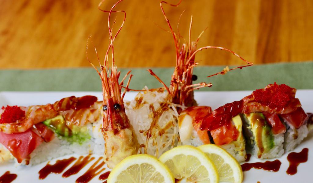 Nari Special · Shrimp tempura inside, one half with red snapper and tuna, the other half with  salmon, topped with sweet shrimp and special sauce (this roll provides a surprise in every bite)