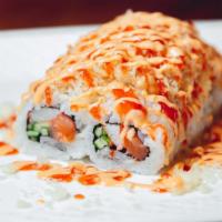 Spicy Crazy Roll · Spicy. Salmon, crab stick, avocado, cucumber, flying fish roe, topped with crunch, spicy sauce