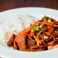 Spicy Pork Bulgogi(Korean Bbq) · Pan fried hot spicy sliced pork and vegetables served on a sizzling platter.
