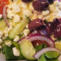 Greek Salad    Romaine Lettuce, Olive, Tomato, Onion And Feta Chees · Romaine lettuce, olive, tomato, onion and feta cheese.