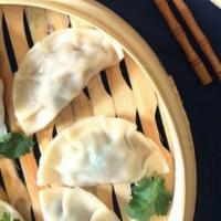 Steam Vegan Dumplings (8 Pcs) · delicious dumpling filled with assorted vegetables.