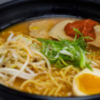 Spicy Ramen · Pork bone broth seasoned with soy and house spicy paste, topped with chashu,  egg, bean spro...