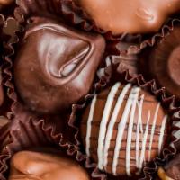 Assorted Chocolates · YOU HAVE AN ASSORTMENT OF DARK AND MILK CHOCOLATES FILLED WITH DECADENT JELLIES, CREAMS AND ...