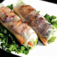 Bún Thịt Nướng Cuốn (Grilled Pork Spring Rolls) · (2) Grilled pork spring rolls served with peanut sauce.